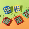 Cross-border XO Tic-shaped Chess keychains for primary school students, plastic board games, three-in-a-row chess toys, hot-selling wholesale game mini Application Scenario